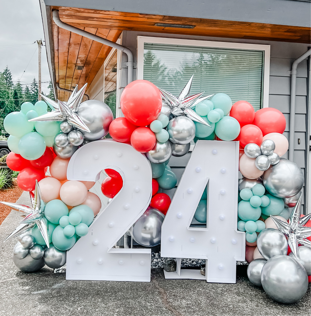 24th birthday party inspo with marquee letters and a metallic balloon garland kit to make your own photoshoot backdrop.