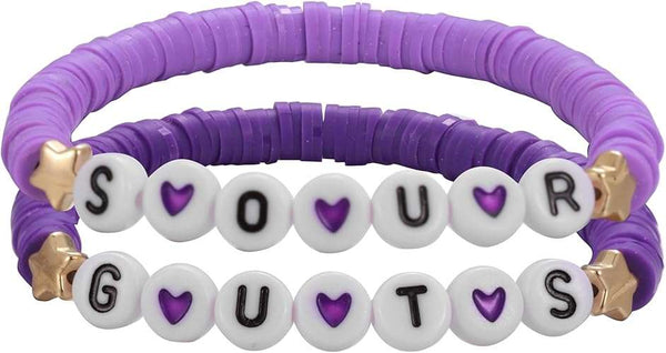 Olivia Rodrigo party activities and craft ideas, featuring an Olivia Rodrigo Guts charm bracelet kit and charm bar package.
