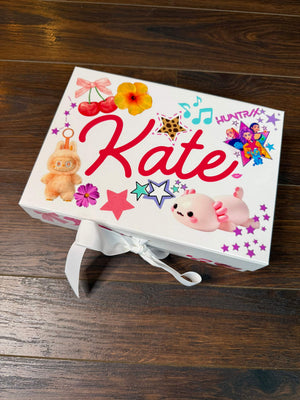 A party favor or party activity for tweens or kids with custom sticker pages featuring huntrix stickers, cherry stickers, and axolotl stickers to decorate your own memento box.