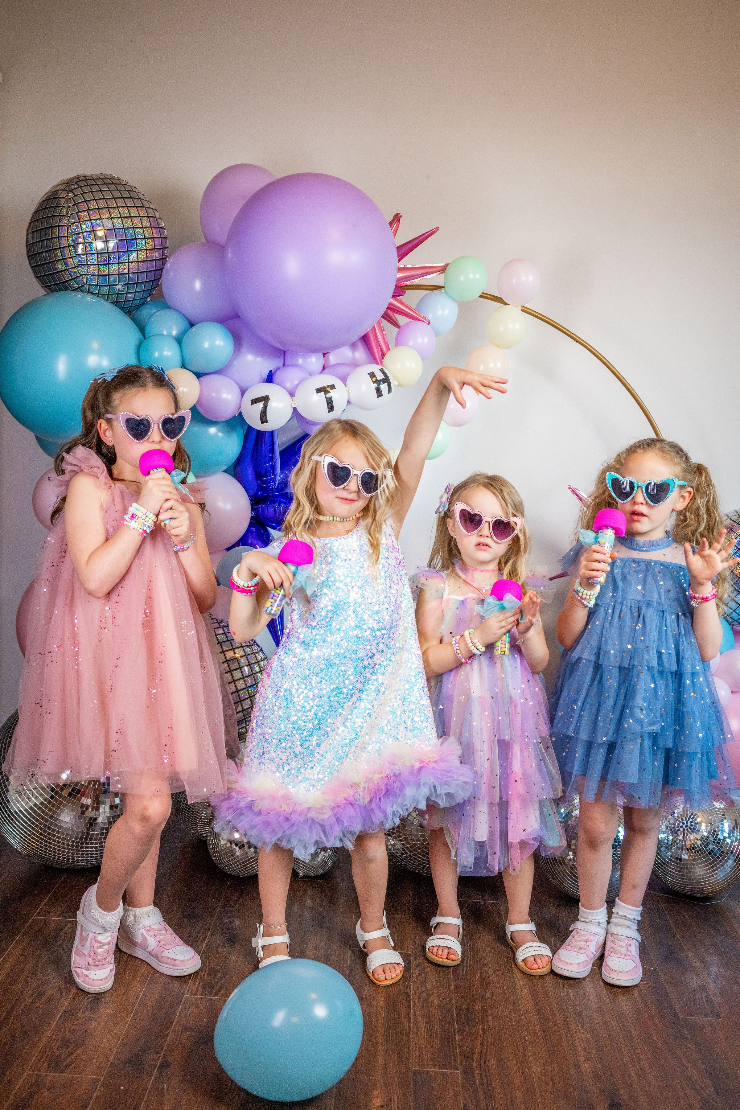 Taylor Swift birthday party inspo for an eras kids birthday party, tween birthday party, or bachelorette party with a lilac and blue diy balloon garland kit.