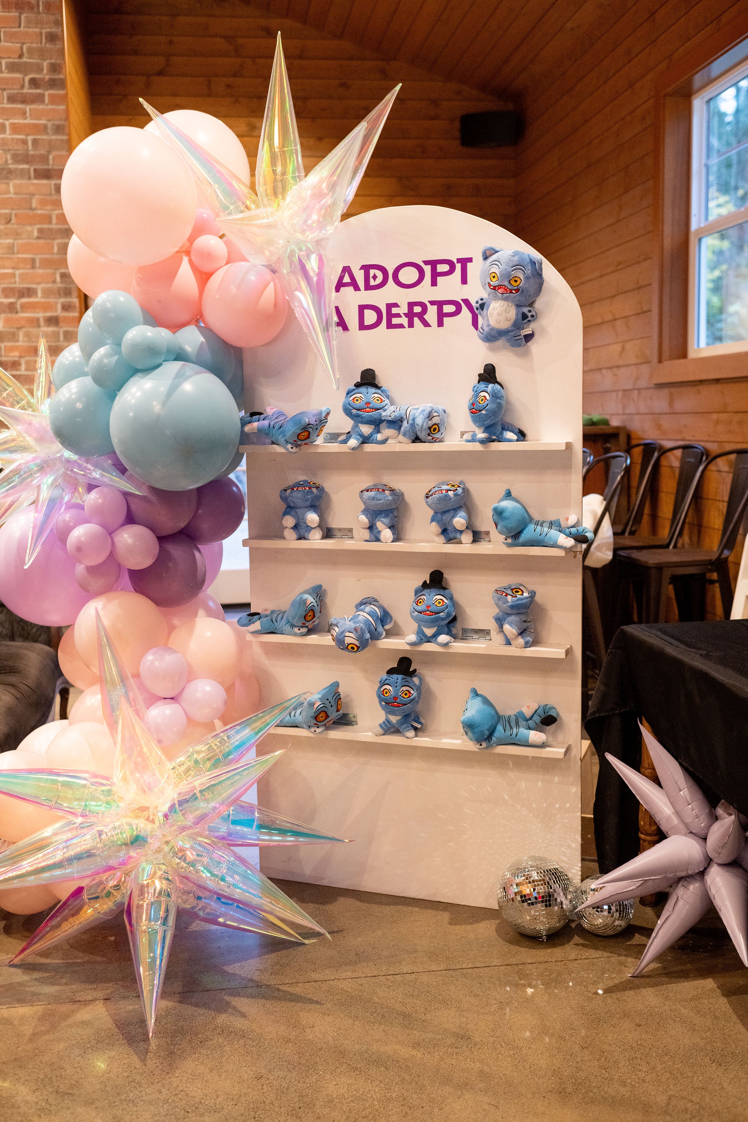 Kpop Demon Hunters Derpy Tiger Huntrx party favors and balloon garland for a tween party favor idea.