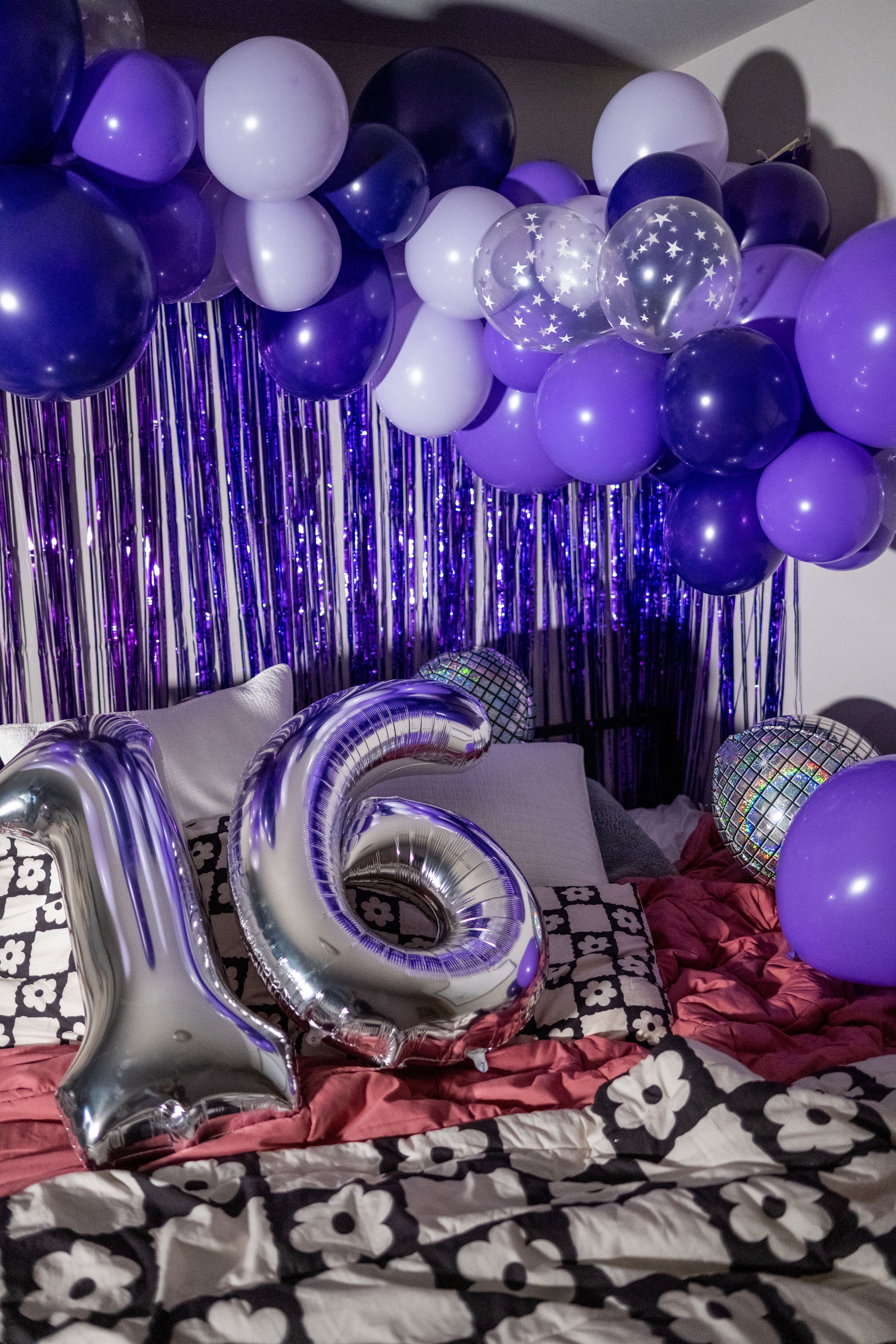 Decoration ideas for a sweet sixteen birthday party or purple party theme with  DIY purple balloon garland decor.