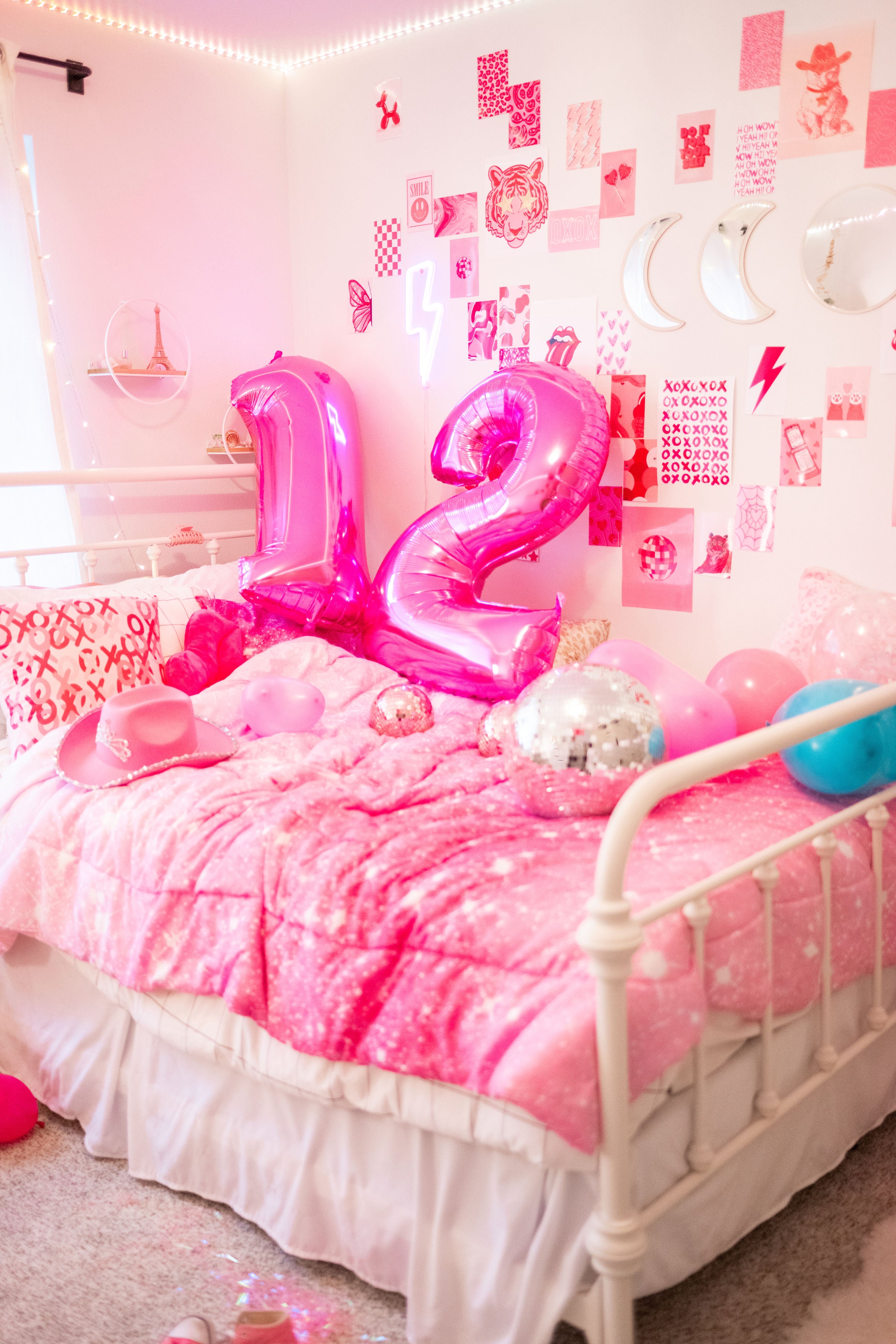 Detail shot from a Barbie birthday party for teens or tweens with DIY pink balloon garland decor and a pink cowgirl hat.
