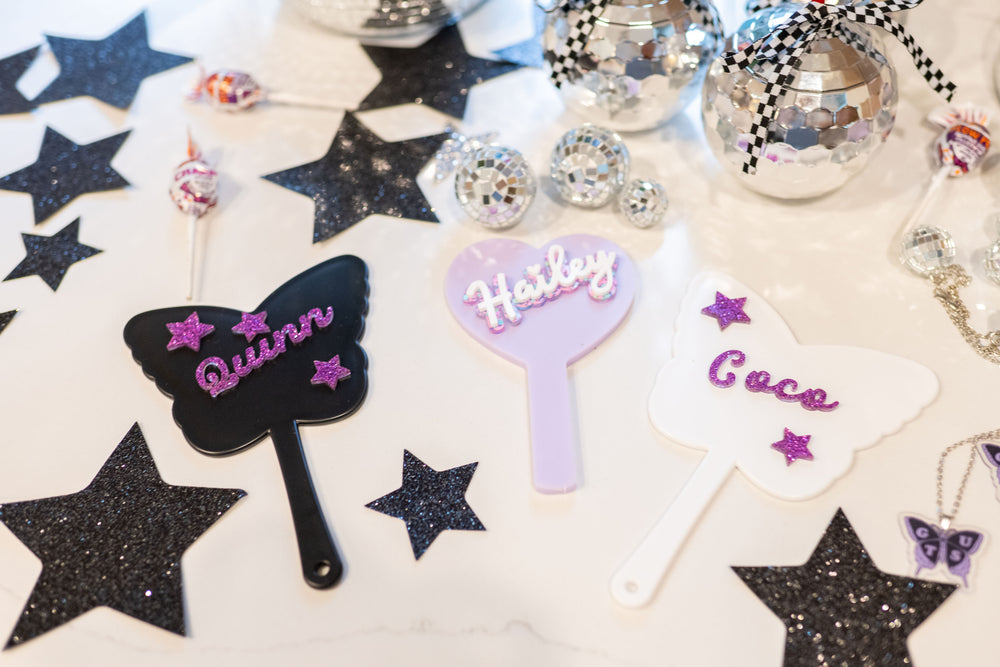 Party favor ideas for an Olivia Rodrigo Guts birthday party  tween birthday party or girls' birthday party, like Olivia Rodrigo butterfly pendant necklaces and personalized butterfly and heart shaped handheld mirrors.