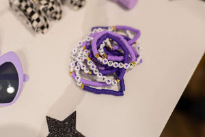 Olivia Rodrigo Guts charm bracelet kit and charm bar package used as an Olivia Rodrigo party activity, party favor, or craft idea.