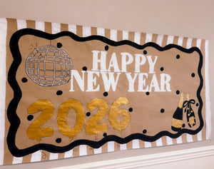 A hand-lettered custom painted gold, black and white banner for a new years eve party with a champagne and caviar theme. 