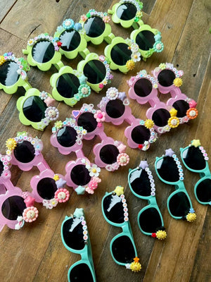 A charm bar party activity or party favor idea with a decorate your own sunglasses kit for a tween or kids girls birthday party.