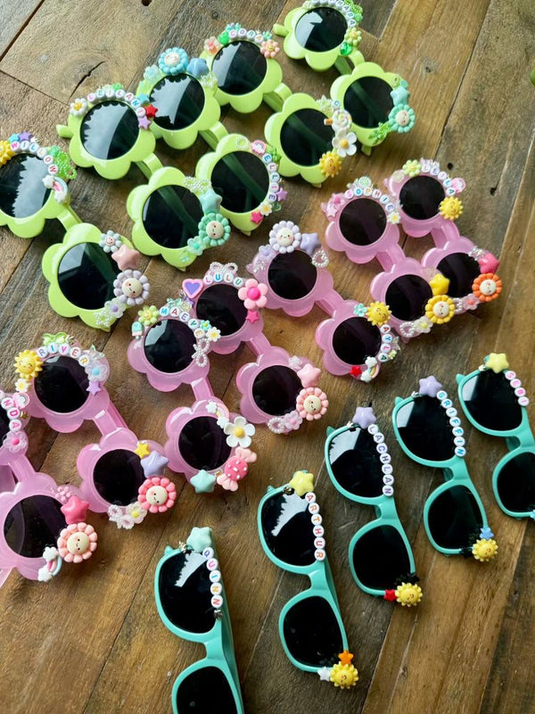 A charm bar party activity or party favor idea with a decorate your own sunglasses kit for a tween or kids girls birthday party.