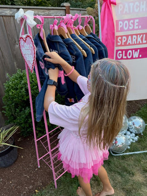 A decorate your own jean jacket party activity idea with customizable patches for a kids or tweens fun birthday party favor.