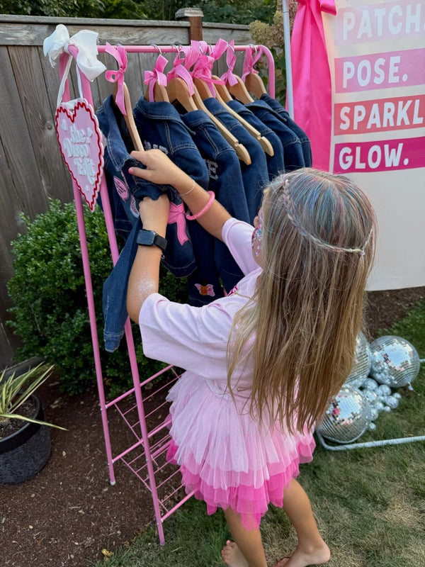 A decorate your own jean jacket party activity idea with customizable patches for a kids or tweens fun birthday party favor.