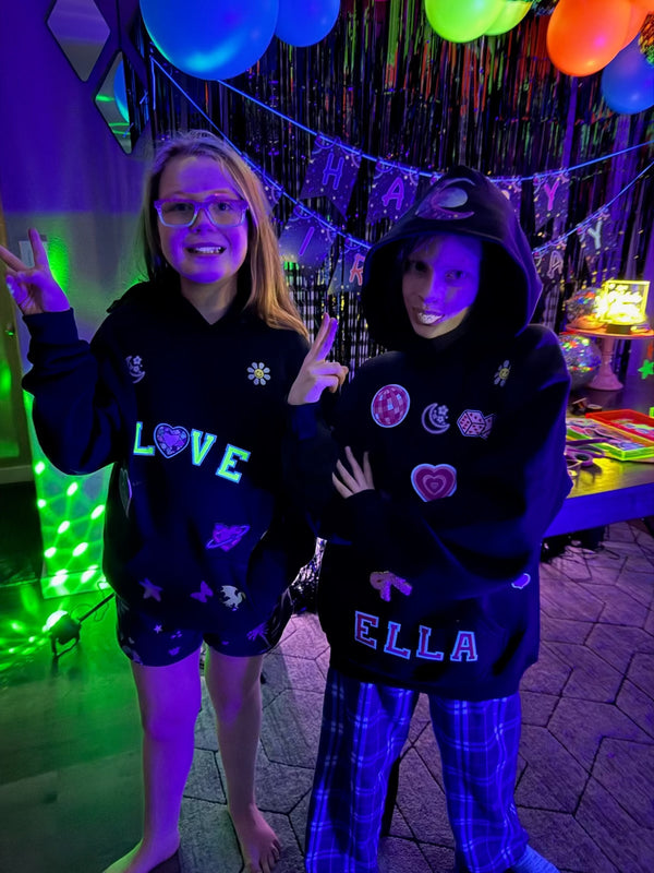 A patch bar party activity idea for tweens or kids featuring a patch party kit to decorate your own sweatshirts with customizable zip-up hoodies.