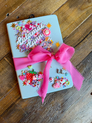 A diy charm bar activity for a party activity or party favor featuring a decorate your own journal craft for tweens or kids.