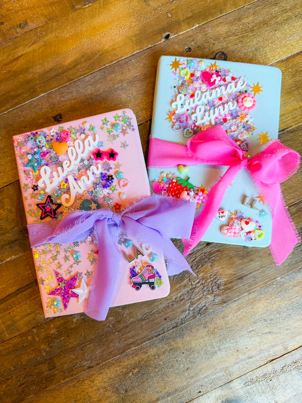 A diy charm bar activity for a party activity or party favor featuring a decorate your own journal craft for tweens or kids.