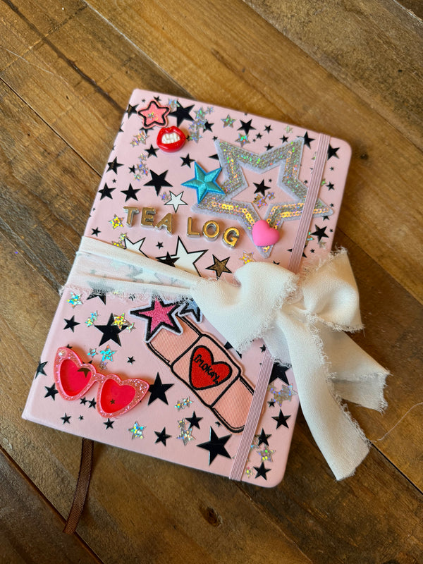 A diy charm bar activity for a party activity or party favor featuring a decorate your own journal craft for tweens or kids.