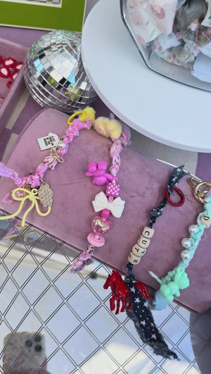 A charm bar party activity or party favor idea with DIY customizable charms for tweens or kids to make personalized keychains for backpacks, sneakers, or book bags. 