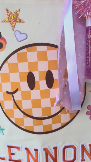 A decorate your own book bag patch bar kit for a Taylor Swift birthday party with Swiftie patches.