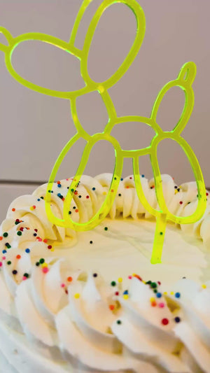 Balloon animal birthday cake topper for a teen or tween birthday party.