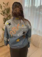 A decorate your own jean jacket party activity idea with customizable patches for a teen or tween birthday party favor.