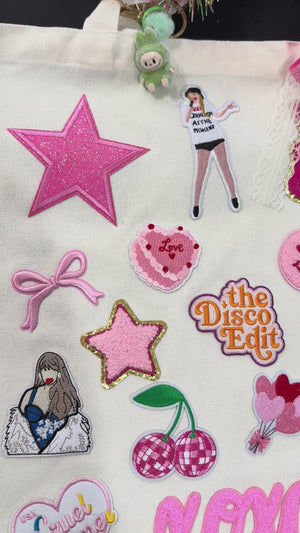 A decorate your own book bag patch bar kit for a Taylor Swift birthday party with Taylor Swift patches.